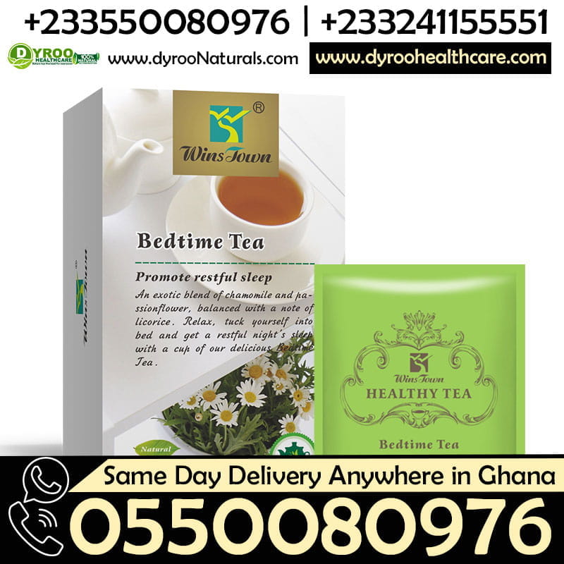 A cup of Dyroo Naturals Wins Town Bedtime Tea with herbal ingredients in a clear glass mug on a cozy wooden table.