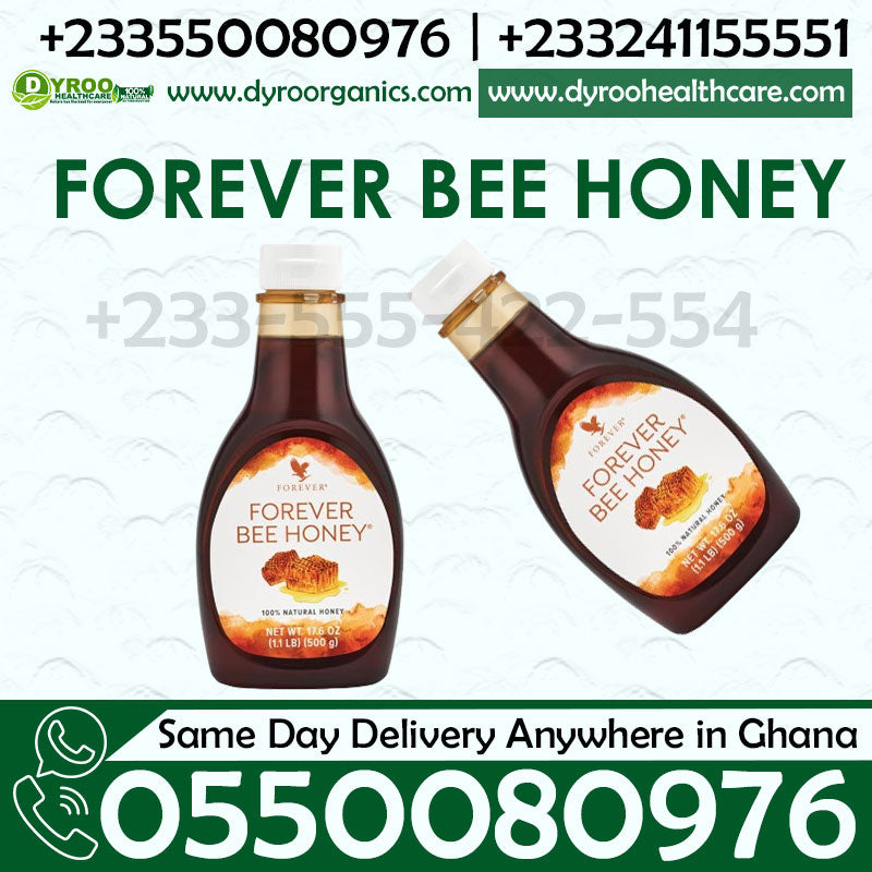Bell jar of Dyroo Naturals Forever Living Bee Honey syrup, showing golden, thick honey with a honey dipper.