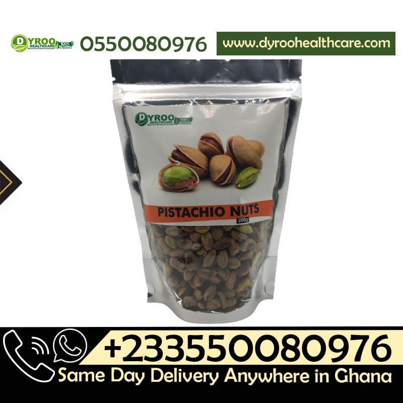 Raw organic pistachio nuts in a bowl, 200 grams, from Dyroo Naturals, showing green and beige shelled pistachios on a wooden surface.