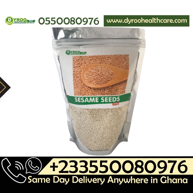 Raw organic sesame seeds in a clear glass bowl, showing small, light tan seeds from Dyroo Naturals on a white background.
